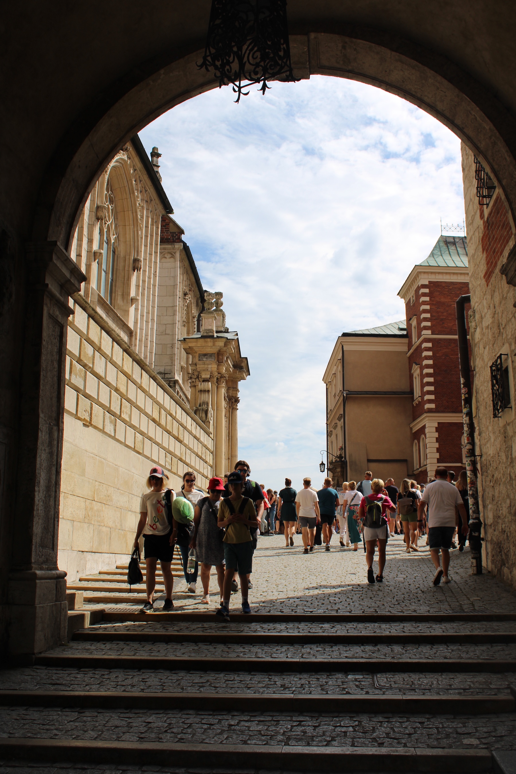 An archway marks the entrance into Wawel Castle