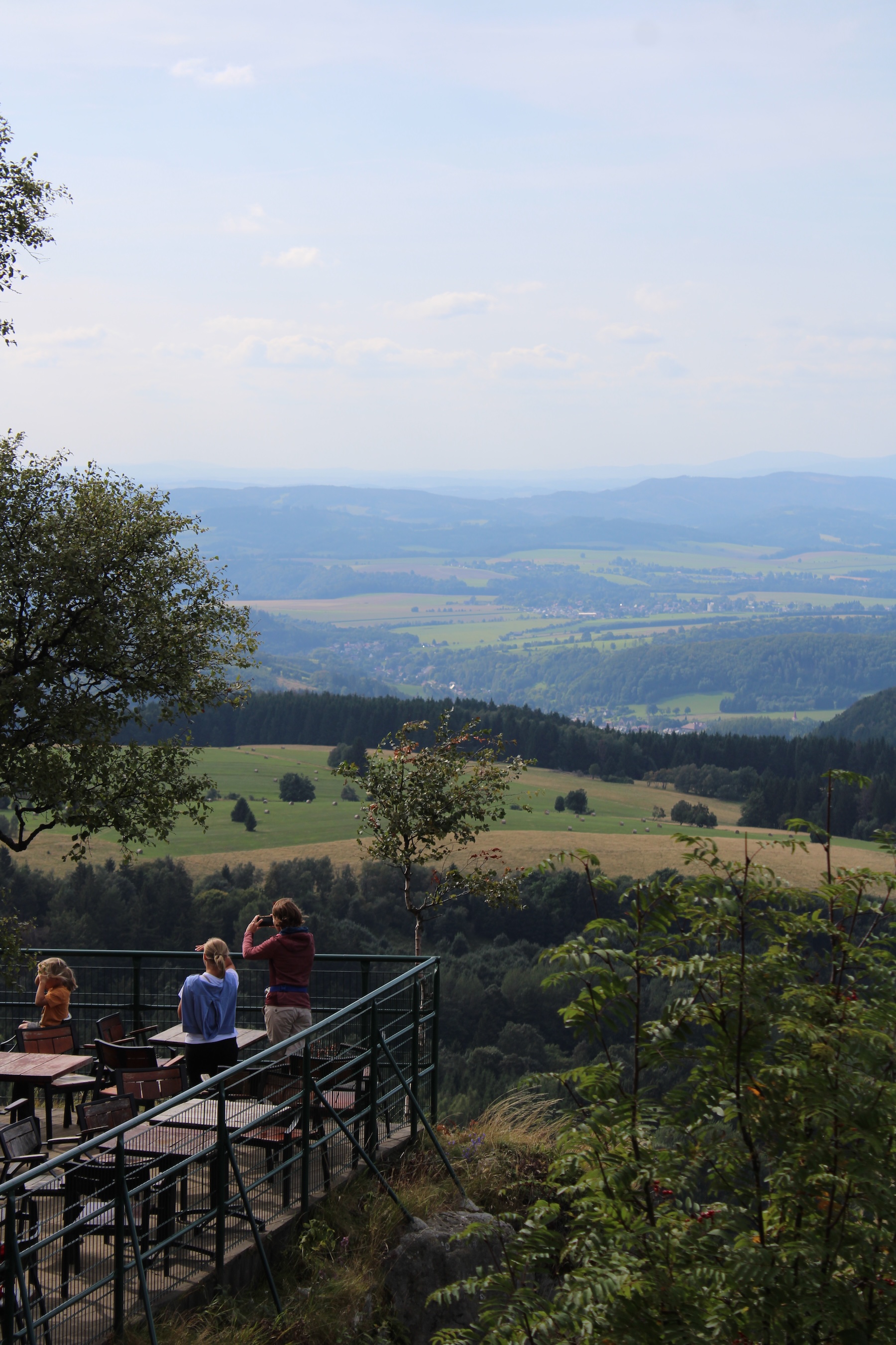 A small balcony and a wonderful expanse of landscape hundreds of feet below and kilometers in the distance.