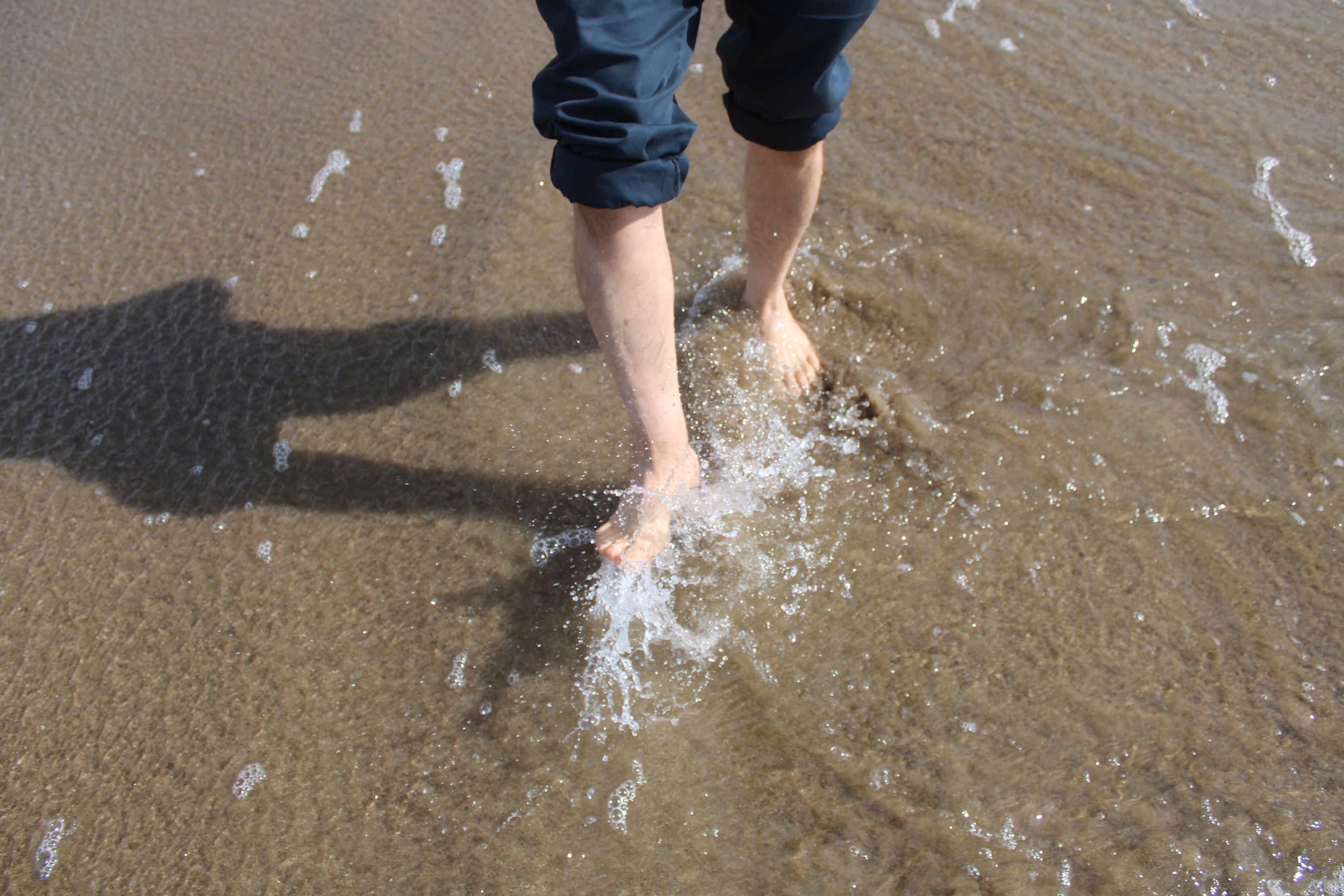 My dad splashes water at me with his feet