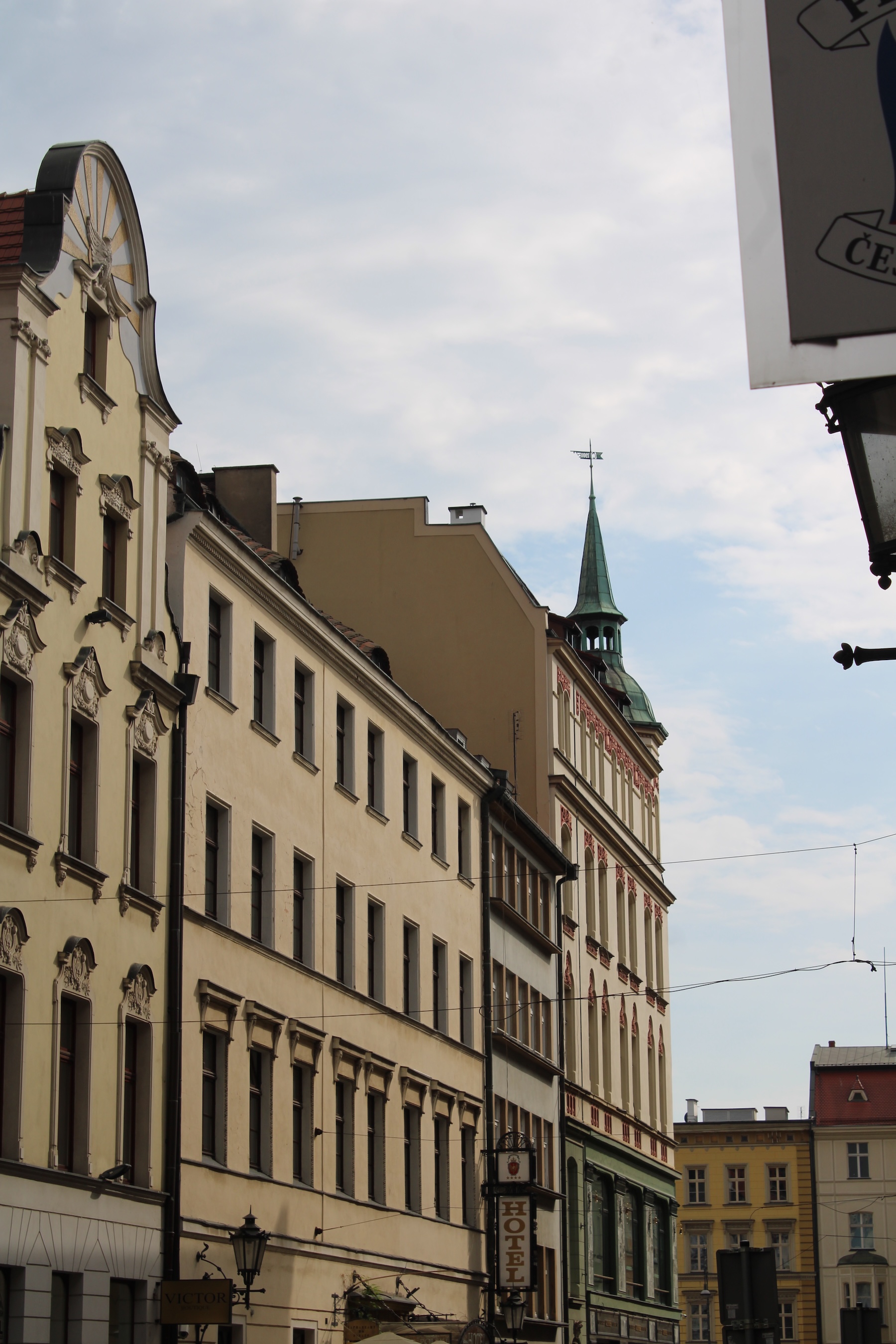 Pale yellow buildings line up next to each other